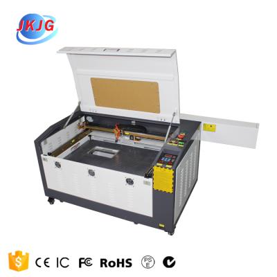 China Laser CUT 4060 Fiber Laser Tube Cutting Machine 80w Metal Cutting Machine and Non Metal Laser CO2 for sale