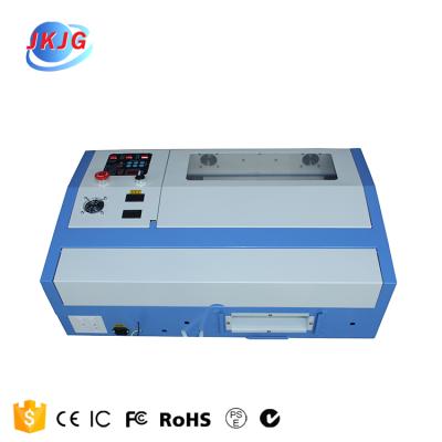 China Laser Form Plastic Fabric PVC Panel Laser Engraving Machine CO2 Laser Wood Leather Cutting Machine 80w 100w 130w 150w for sale