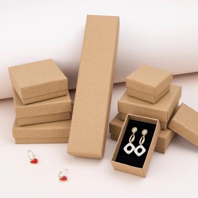 China Eco-friendly Jewelry Packaging Cardboard Gift Box Rectangular Jewelry Sponge Lined Black Cowhide Leather White Cardboard for sale