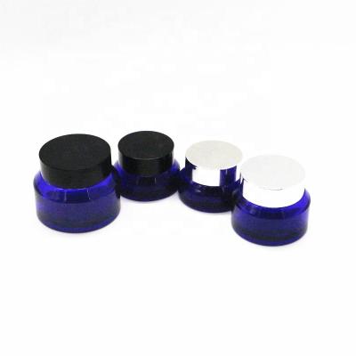 China Custom Oblique Blue Cosmetic Cream Jar 30g 50g Cobalt Glass Shoulder Personal Care Jar Packaging With Lids for sale