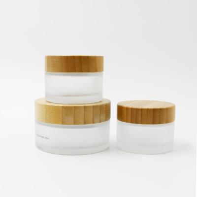 China White Transparent Personal Care Paste Cosmetic Packaging Glass Eye Cream Thick Bottom Luxury Cosmetic Jar With Wooden Lid Cap for sale