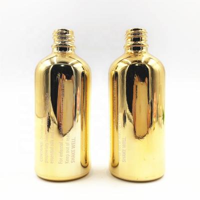 China High End 100ml Personal Care Electroplate Essential Oil Wholesale Essential Oil Glass Bottle, Gold Cosmetic Packaging With Cap for sale