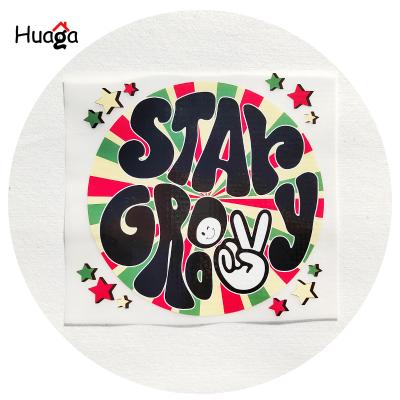 China Huaga Factory Strong Elasticity High Quality Iron On Sticker Heat Transfer Plastiso Screen Printed Custom Designs For T Shirts for sale