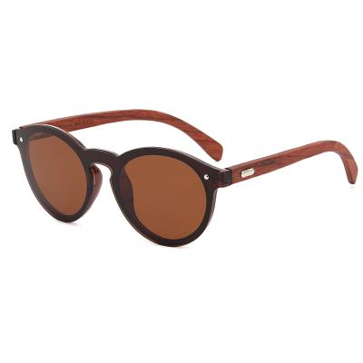 China New Fashion Sunglasses Wooden Bound Polarized Sunglasses For Women Fashion Round Frame Walnut Leg Sunglasses For Men To Drive for sale