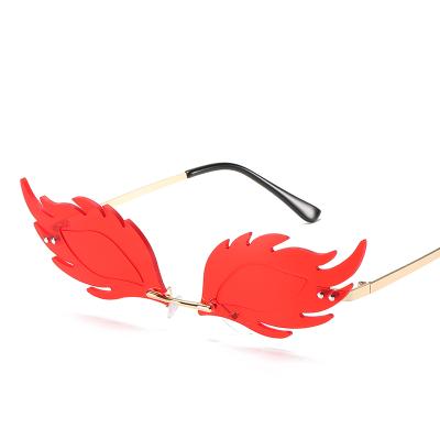 China New Fashion Sunglasses Fish Rimless Sunglasses Women Shape Metal Rimmed Ocean Piece Sunglasses Flame Feather Hedgehog Sunglasses for sale