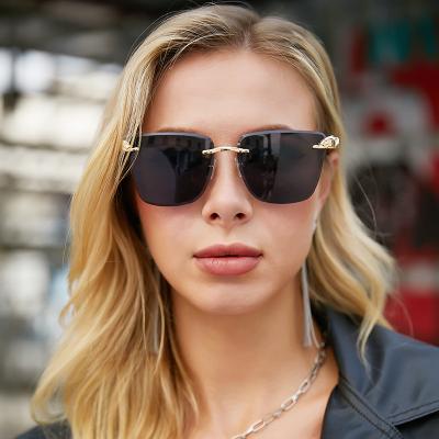 China New Arrival High Quality CIS Style Rimless Style Unique Metal Cheetah Decoration Women Sunglasses Sunglasses for sale