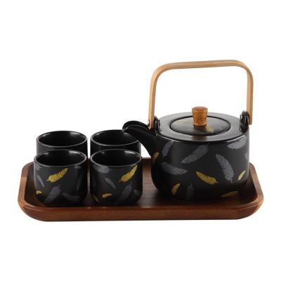 China Japanese Style Handle Sustainable Wooden Teapot Black Ceramic Tea Set With Bamboo Tray for sale