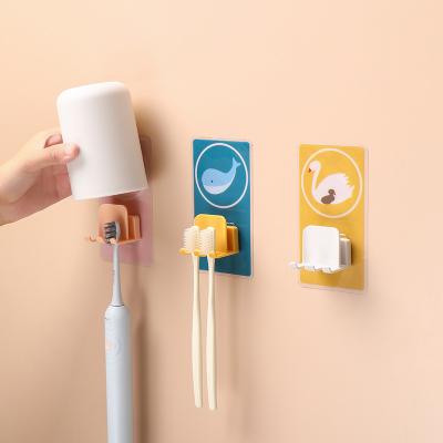 China Sustainable Clamping Adhesive Toothbrush Holder Animal Pattern Wall Toothbrush Holder for sale