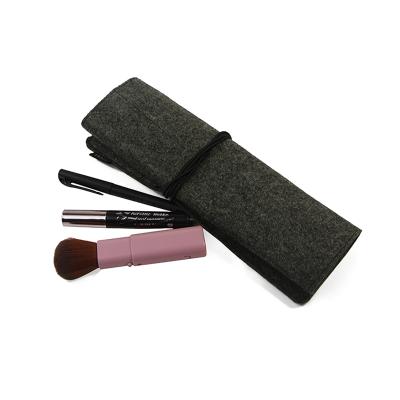 China Recyclable Custom Elastic Pencil Storage Felt String Cosmetic Roll Bag With Small Interior Pockets for sale