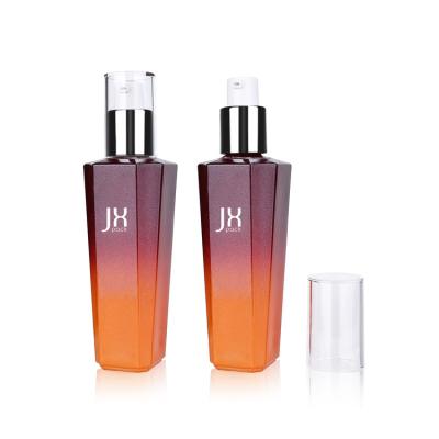 China Personal Care Custom Gradient Glass Red Cosmetic Lotion Bottle With Lotion Pump For Skin Care Packaging for sale