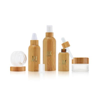 China 20 50 100ml Custom Empty Bamboo Container Cosmetic Skin Care Packaging Glass Lotion Pump Bottle for sale