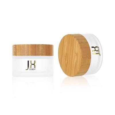 China Cosmetic Glass Jar 20g 40g Facial Cream Jar With Bamboo Lid Matte White Cosmetic Jar for sale