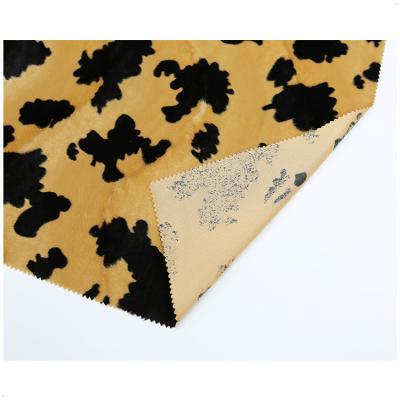 China 100 designs flame retardant polyester animal skin print velboa textile fabric/cow for sale