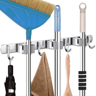 China Sustainable Broom Mop Holder Wall Mount, 304 Stainless Steel Storage Organizer Wall Mounted Broom Storage Rack Hanger with 3 Holders 4 Hooks for sale