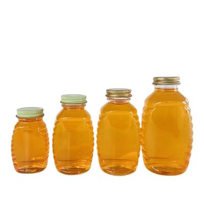 China Beverage PET Plastic Transparent Honey Bottle , Food Grade Aluminum Cap Plastic Beverage Bottle for sale