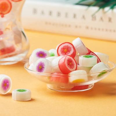 China Natural Beautiful Even Peach Blossom Shaped Hard Candy Manufacturer Factory Price for sale