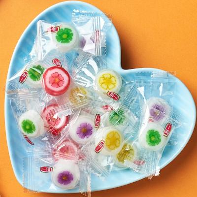 China Peach Blossom Flower Shape Natural Fat Free Mix Hard Handmade Sweet Lollipops for sale