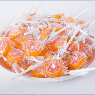 China 2019 Normal Wholesale Natural New Fruit Lollipop Hard Orange Juice Lollipop for sale