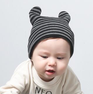 China Hooded cap cute baby curly striped baby hat autumn and winter boys and girls knitted hat wool cap wholesale for sale