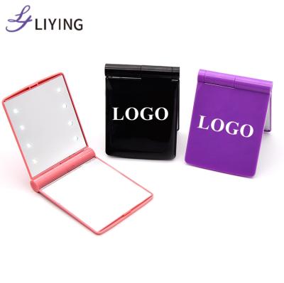 China Custom Travel Lighted 8 LED Logo Pocket Lights Lights Folding Mini Portable Hand Vanity Makeup LED Light Mirror for sale