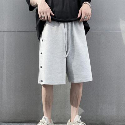 China Anti-Wrinkle Mens High Street Basketball Shorts Solid Color Button Pocket Gym Loose Shorts for sale