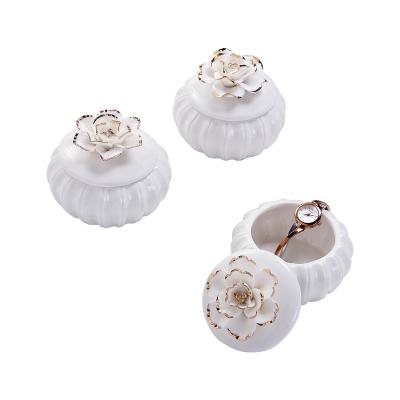 China Wedding Durable White Round Ceramic Jewelry Trinket Box With Handmade Golden Edge Flower Lid for sale