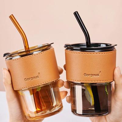 China Sustainable Custom Reusable Leak-Proof Ins Style Amber Glass Milk Tea Cup Coffee Mug With Leather Holder And Straw for sale