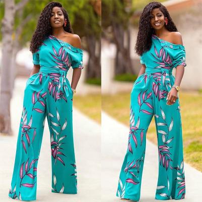 China Anti-pilling summer 2021 printed holiday floral shoulder sashes irregular wide leg women plus size jumpsuit for sale