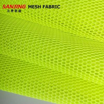 China 100% Hexagonal Air Mesh Fabric Tear-Resistant Breathable Polyester Double Holes For Garment Backpack for sale