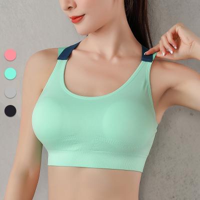 China Breathable Wholesale Crisscross Back Padded Strappy Yoga Bras With Removable Seamless Cups Sports Bra for sale