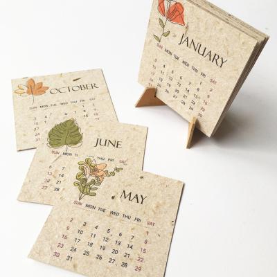 China Present Europe Christmas Gift Idea 2022 Biodegradable Eco-paper Handmade Recycled Implantable Calendar Seed Paper for sale