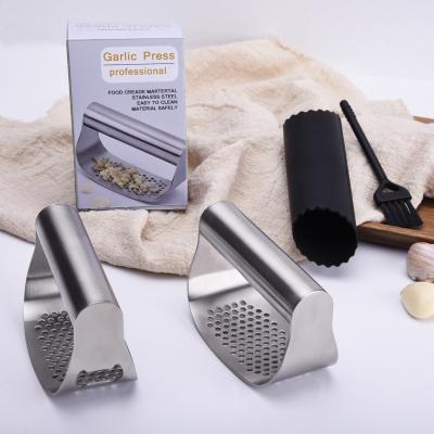 China Garlic Press Food Grade Stainless Steel Ginger Rocker Cleaver Garlic Crusher Tool Vegetable Garlic Press for sale