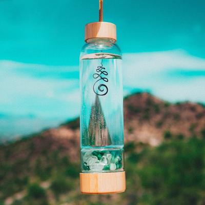 China Viable Amethyst Chip Stone Drink Tea Bottle with Crystal Stone Glass Crystal Water Bottle for sale