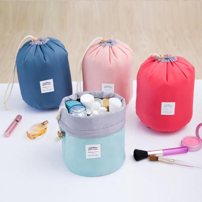 China Fashion Cylinder Multifunctional Foldable Travel Bag Cosmetic Toiletry Organizer Women Draw String Make Up Bag for sale