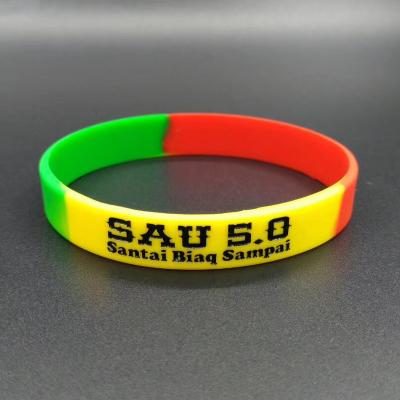 China Custom Debossed Promotion Gift Embossed Logo Silicone Wristband Customized Glow in Dark Promotion Silicone Wristband for sale