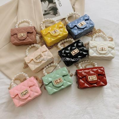 China New Style Fashion Little Girl Portable Handbags Mini Cute Grid Jelly Baby Kids Party Bag Pearl Bow Children's Party Chain Messenger Purse for sale