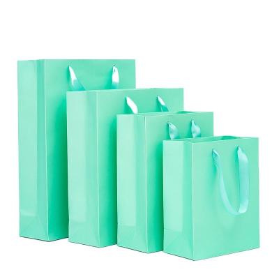 China Recyclable Personalized Bag En Packaging Business Carrier Clothes Packaging Bags Custom Shopping Paper Bags For Boutique for sale