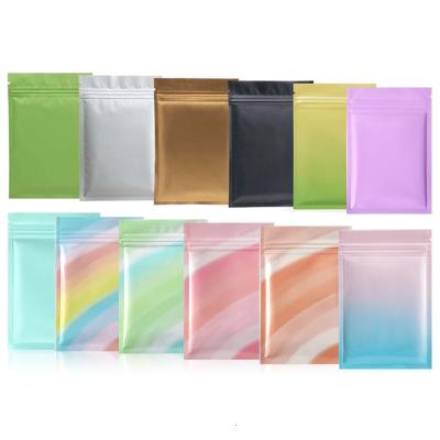 China 100 Pcs Disposable Shiny Rainbow Color Heat Sealing Packaging Bag Smell Proof Aluminum Foil Ziplock Plastic Mylar Flat Lock Bags for sale