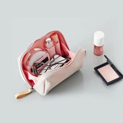 China Customized Small Style Makeup Bag Beauty Brush Korean Solid Mini Cosmetic Bags Waterproof Nylon Bags for sale