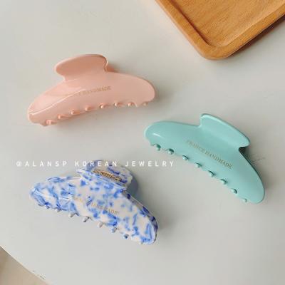 China Fashion MuXi Korea Niche Acetate Hook Clip Comb Temperament Large Shark Clip Pure Color Hair Hook for sale