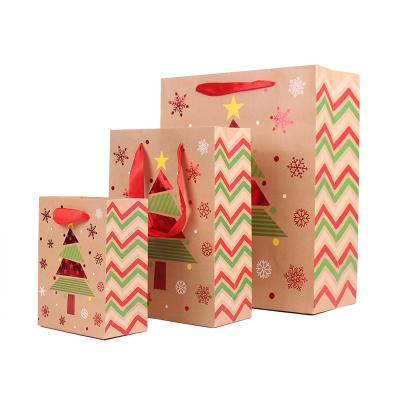 China JM-232 Recyclable Christmas Brown Kraft Paper Gift Bags With Handle Assorted Christmas Prints For Gifts for sale