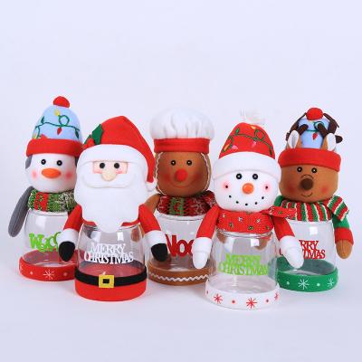 China YQ-9018 Christmas Candy Jar Kids Gift Eco-Friendly Santa Snowman Ornament Plastic Storage Bottle With Plush Doll Lid for sale