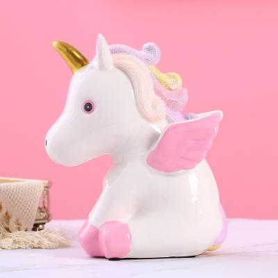 China Ceramic Baby Unicorn Piggy Bank Gold Pink Coin Bank for sale