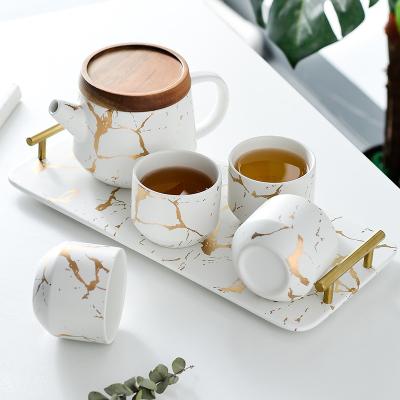 China Hot Selling Luxury Modern Teapot Viable Ceramic 4 Piece Tall Teapot Marble Tea Set Tea Set With Wooden Tray for sale