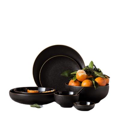 China Disposable luxury matte glaze wedding restaurant food serving ceramic black dinner set with gold rim for sale