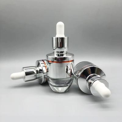 China Luxury Cosmetic Silver Aluminum Cover 30ml Essential Oil Serum Glass Dropper Bottle for sale