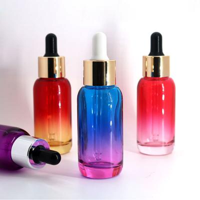 China Beautiful 30ml cosmetic hot sale cosmetic colorful translucent dropper bottle with gold dropper can be customized LOGO for sale