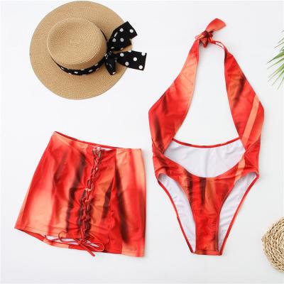 China Breathable Women's 2 Piece Swimsuits Printed Halter Deep V-neck Bikini Set With Sarong Cover Up Skirt for sale