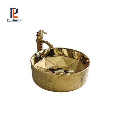 China Scratch Proof Round Luxury Gold Plated Ceramic Bathroom Sink Hand Vessel Sink Porcelain Table Top Sink for sale