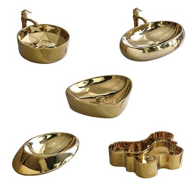 China Scratch Proof Fashion Oval Hand Wash Basin Handmade Shiny Gold Ceramic Bathroom Sink for sale